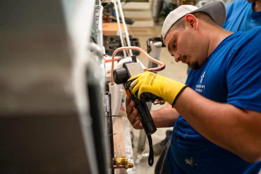 Electrify My Home technician installing air conditioner in Suisun City Northern California
